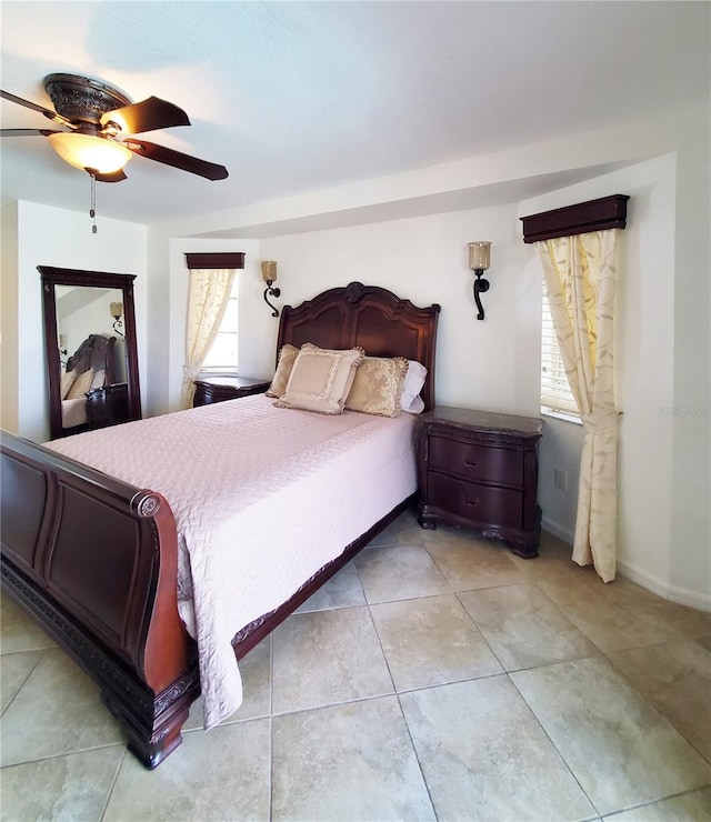 tiled bedroom with ceiling fan