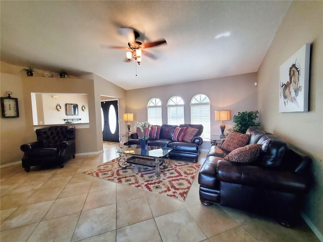 509 Clearview Dr, Port Charlotte, FL 33953 - living area featuring ceiling fan, light tile patterned flooring, vaulted ceiling, and baseboards
