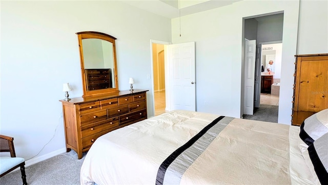 bedroom featuring light colored carpet