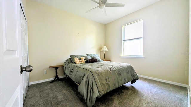 carpeted bedroom featuring a closet and ceiling fan