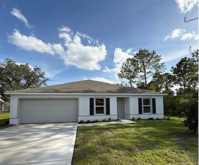 ranch-style house featuring stucco siding, an attached garage, driveway, and a front yard