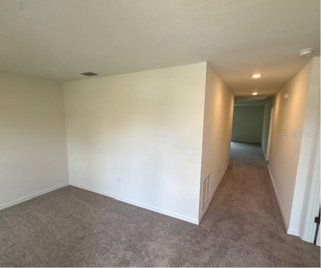 interior space with dark colored carpet