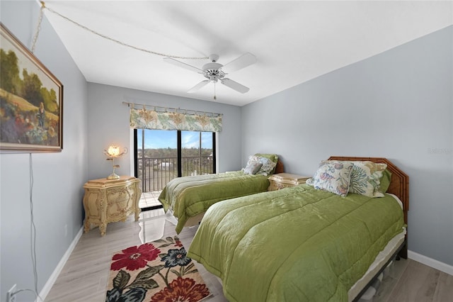 bedroom with light hardwood / wood-style floors, access to outside, and ceiling fan