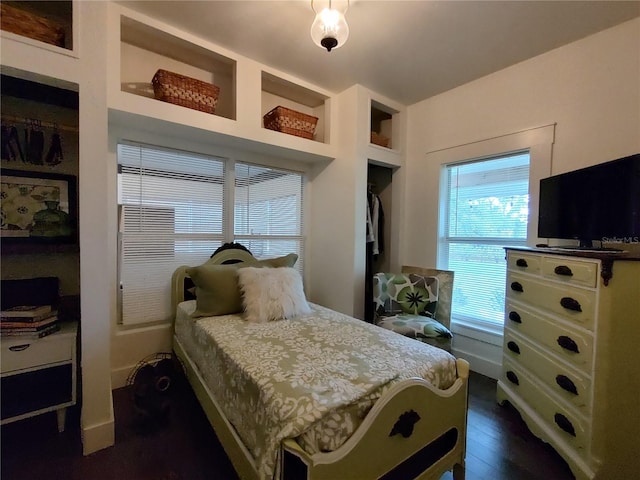 bedroom featuring a closet and dark hardwood / wood-style flooring