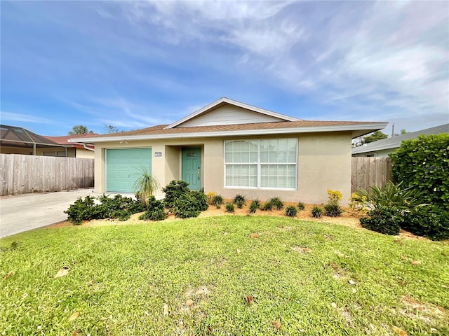 ranch-style home with a garage and a front lawn