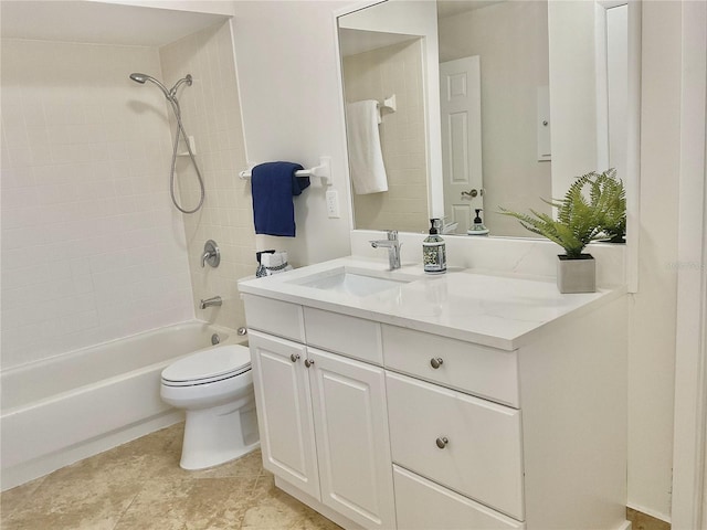 full bathroom featuring vanity, tiled shower / bath combo, and toilet