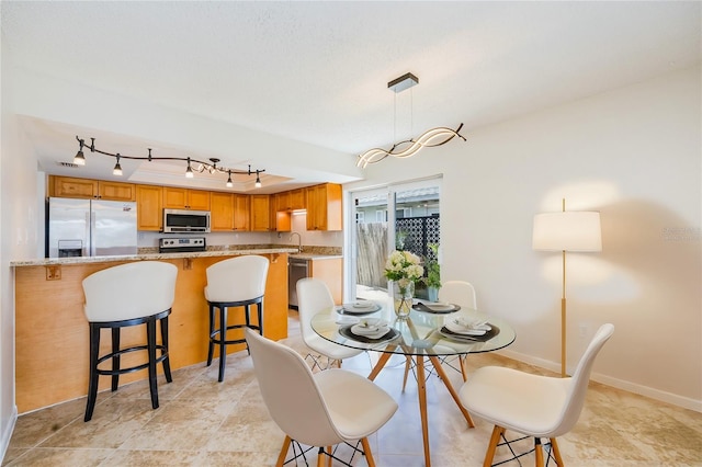 dining room with rail lighting