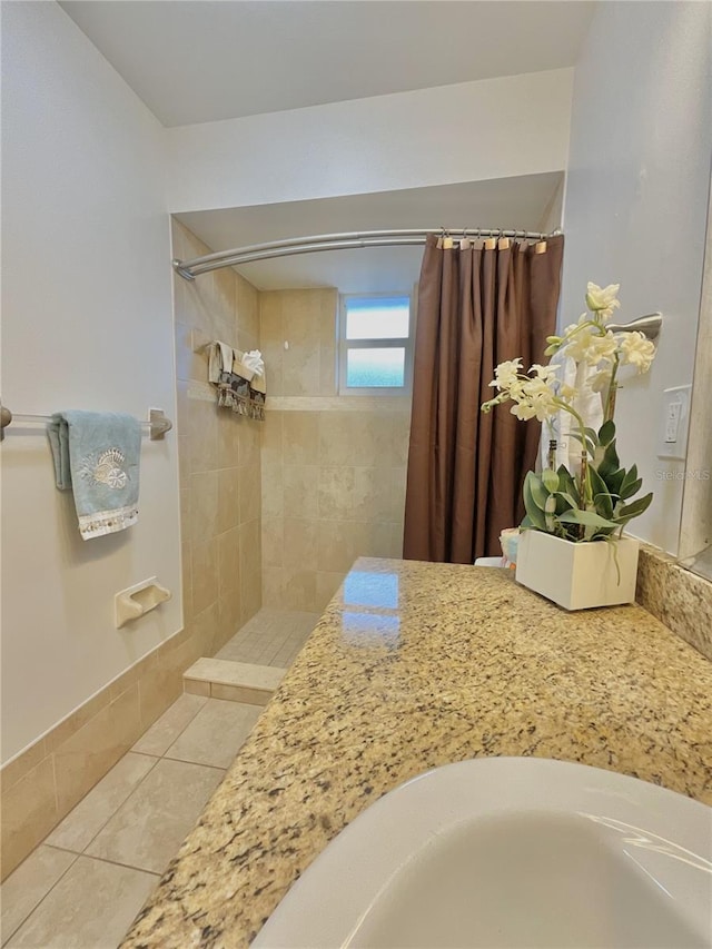 bathroom with a shower with curtain and tile patterned floors