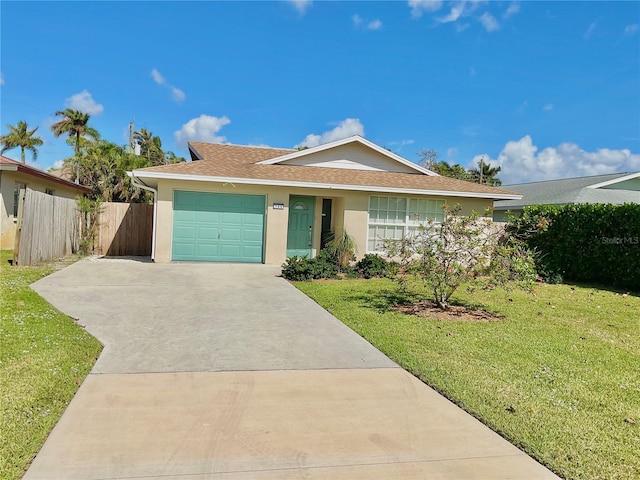 ranch-style house featuring a garage and a front lawn