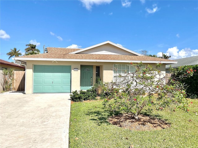 single story home with a garage and a front yard