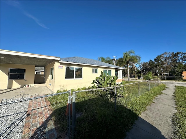 view of side of property with a patio