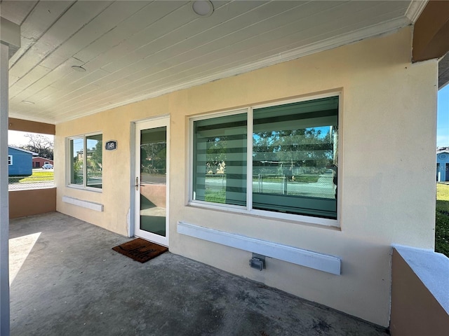 doorway to property featuring a patio