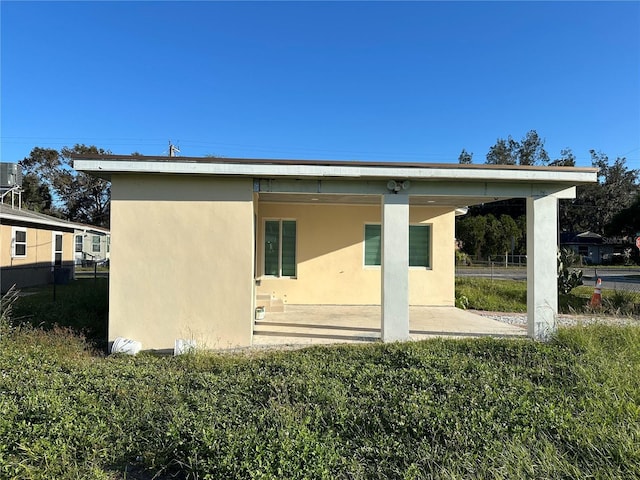 back of house with a patio