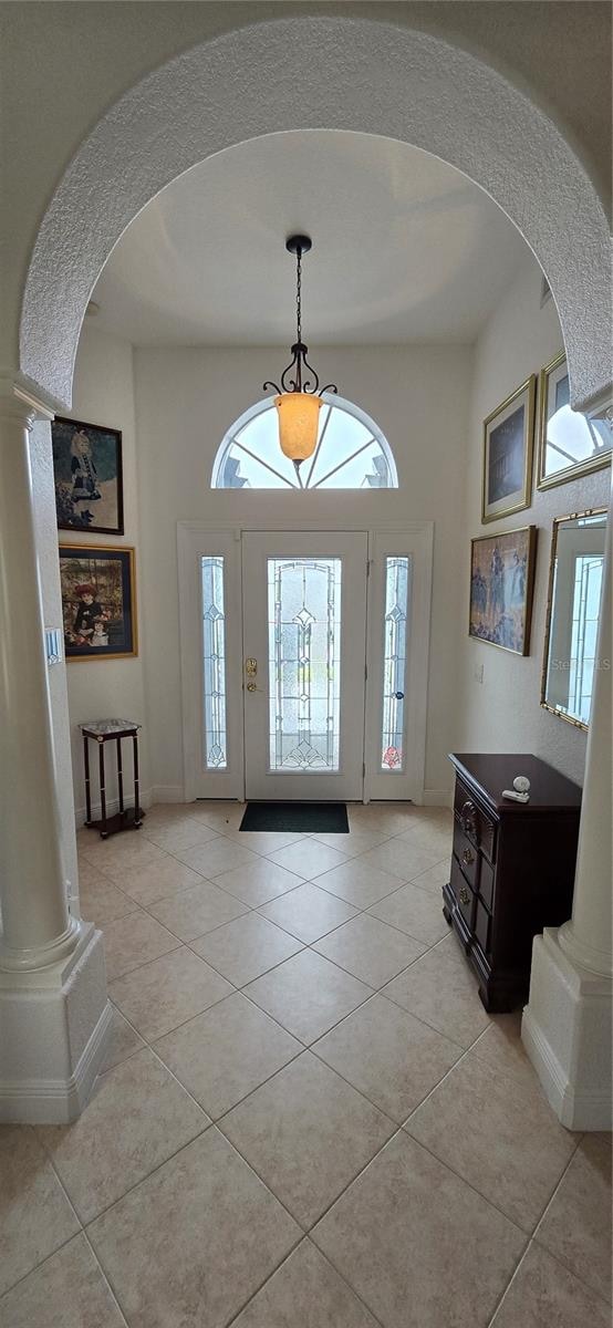 foyer entrance with light tile patterned floors