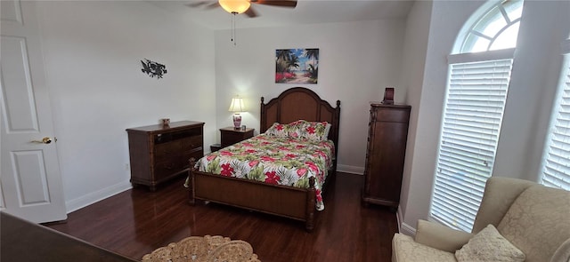 bedroom with dark wood-type flooring and ceiling fan