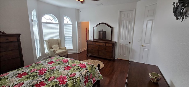 bedroom with dark wood-type flooring and ceiling fan