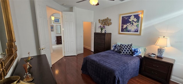 bedroom with dark hardwood / wood-style floors and ceiling fan