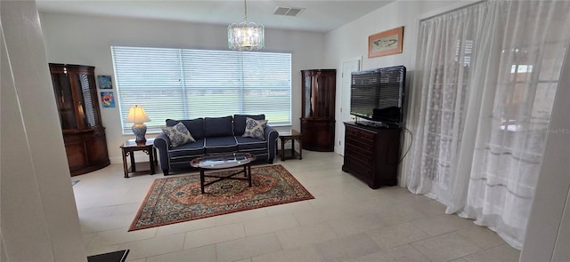 living room featuring a notable chandelier