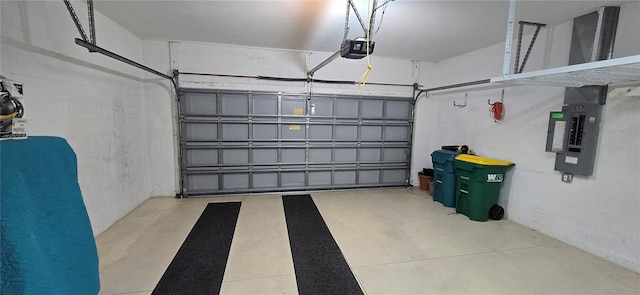 garage with a garage door opener and electric panel