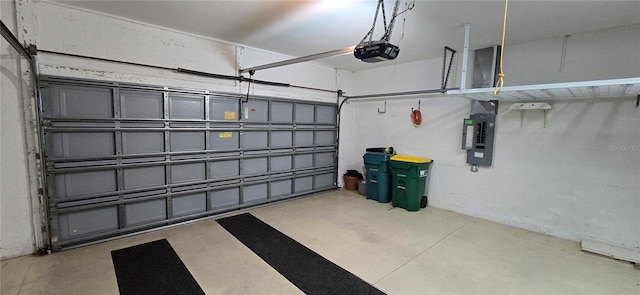 garage with a garage door opener and electric panel