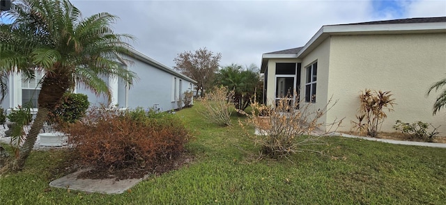 view of home's exterior with a yard