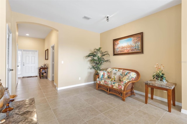 living area featuring light tile patterned floors