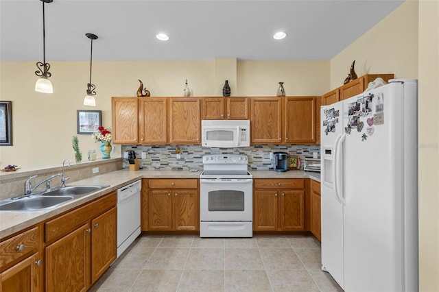 kitchen with white appliances, light tile patterned flooring, sink, pendant lighting, and decorative backsplash