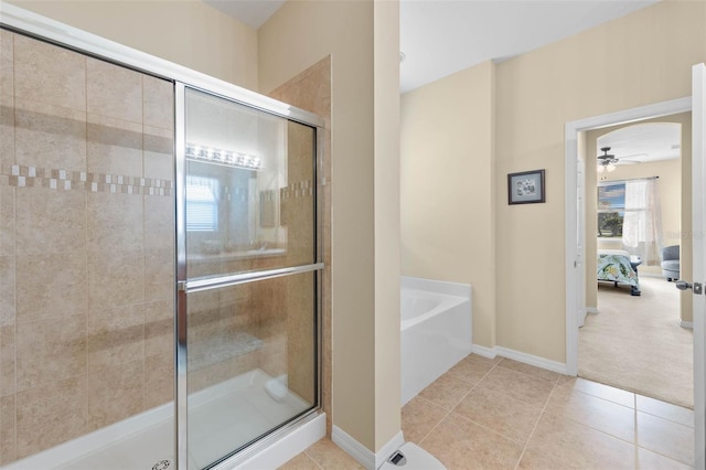 bathroom with ceiling fan, tile patterned floors, and plus walk in shower