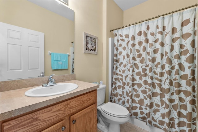 bathroom with vanity, toilet, tile patterned flooring, and a shower with shower curtain