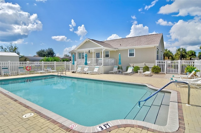 view of swimming pool with a patio