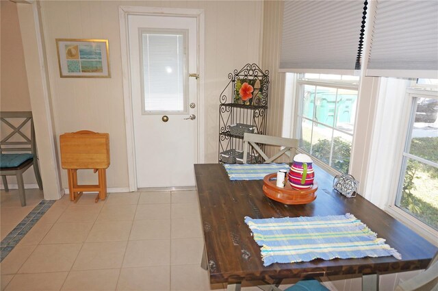 dining area featuring light tile patterned floors