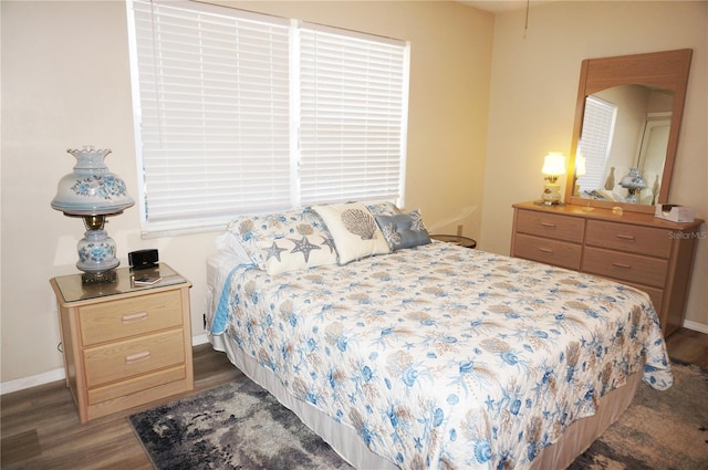 bedroom featuring dark hardwood / wood-style flooring