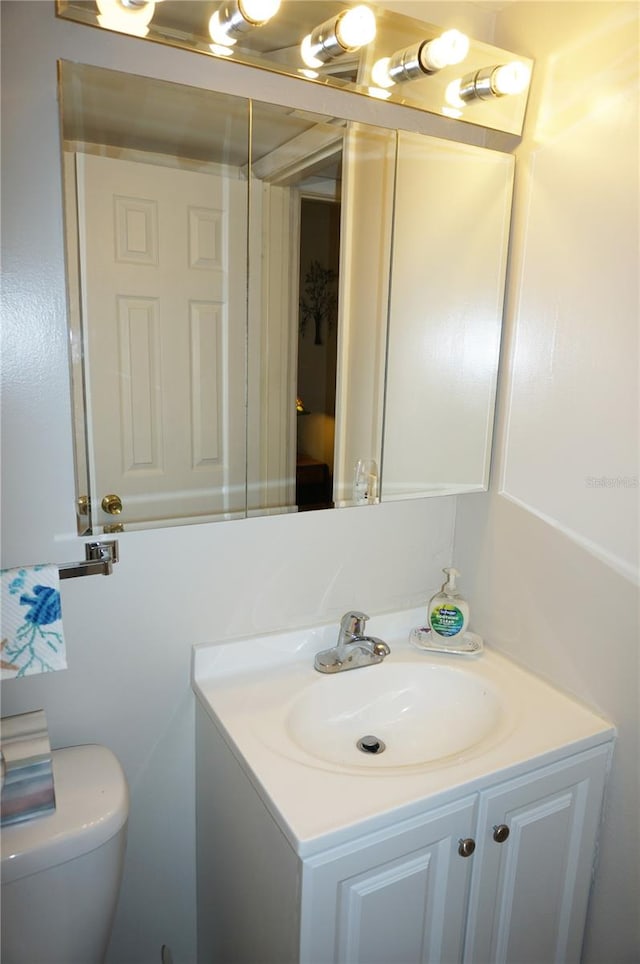 bathroom with vanity and toilet