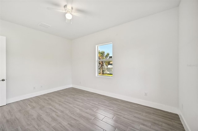 unfurnished room featuring light hardwood / wood-style floors and ceiling fan