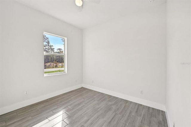 unfurnished room featuring light hardwood / wood-style floors and ceiling fan