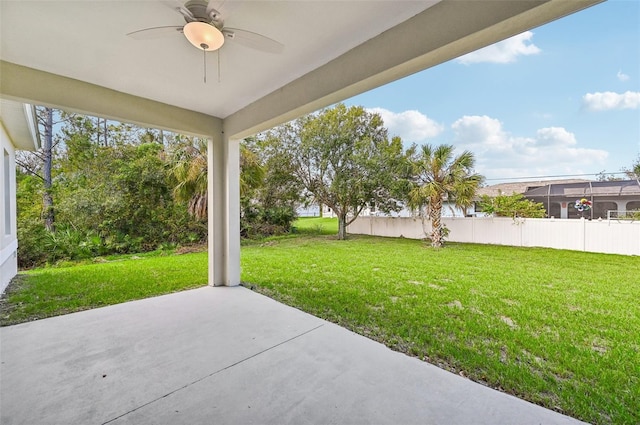 view of yard with a patio and ceiling fan