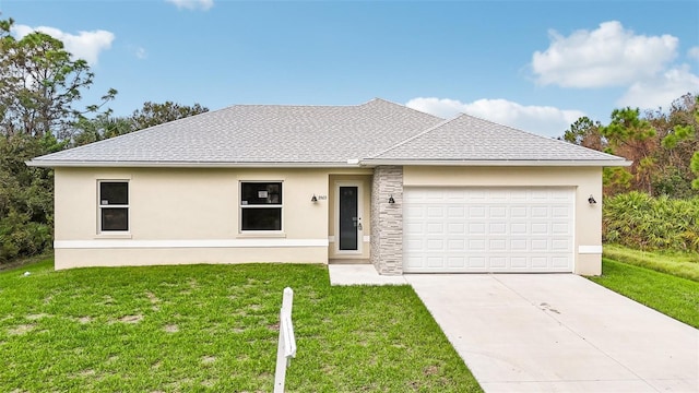 view of front of house with a front yard and a garage