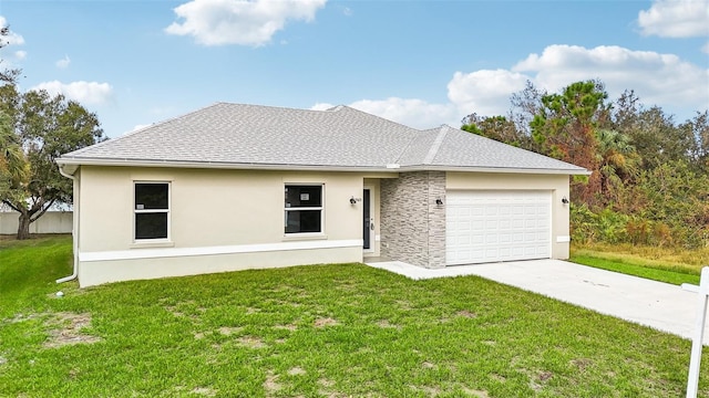 view of front facade featuring a garage and a front lawn