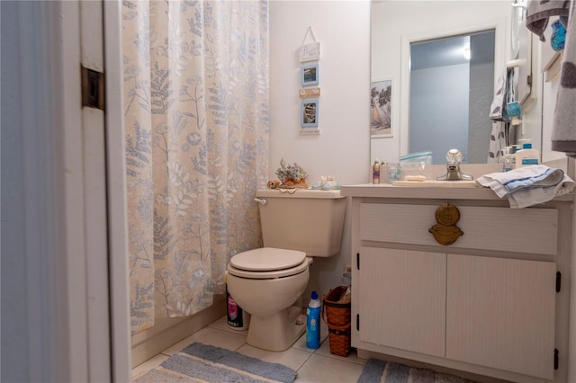 bathroom featuring tile patterned floors, vanity, and toilet