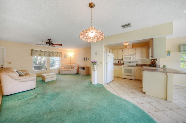 tiled living room with sink, a textured ceiling, and ceiling fan