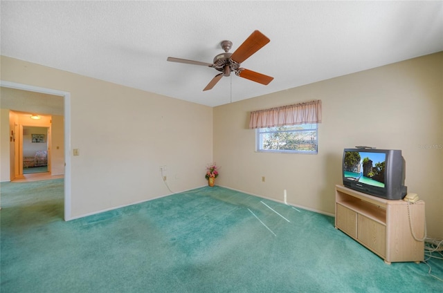 interior space featuring ceiling fan and carpet floors