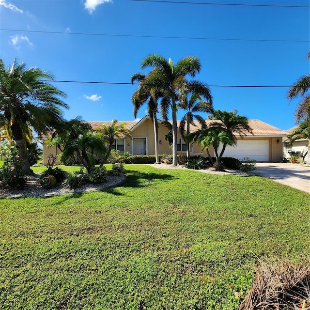 view of front of house with stucco siding, concrete driveway, a front yard, and a garage