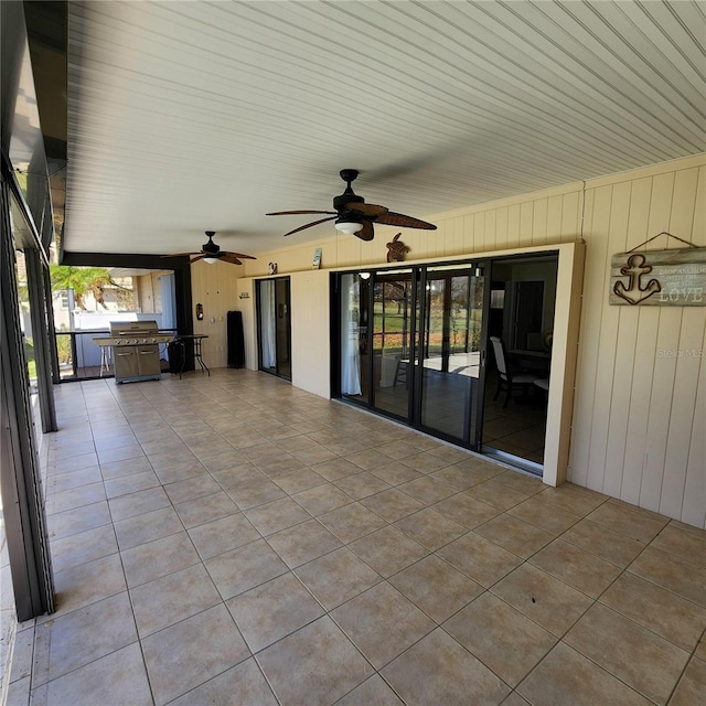 view of patio featuring ceiling fan