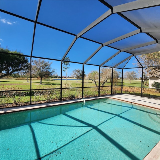 view of swimming pool featuring a rural view and glass enclosure