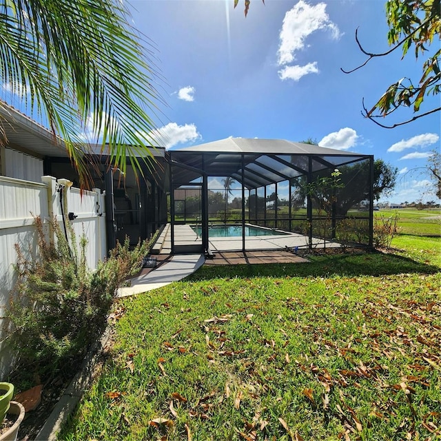 view of yard featuring a patio area and a lanai