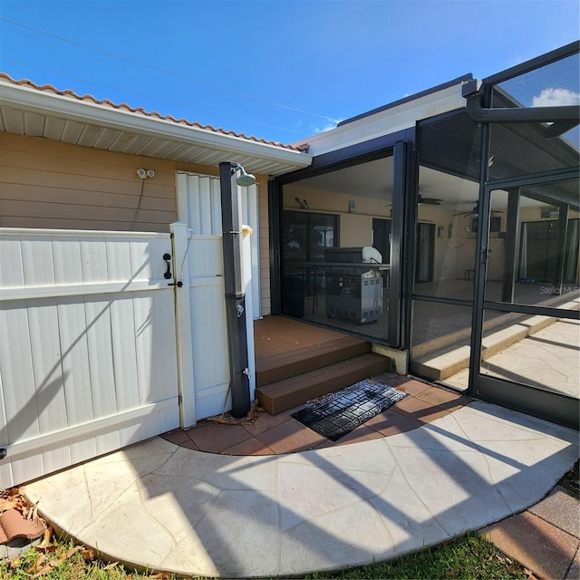 entrance to property featuring a patio area