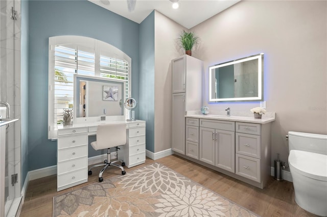 office space featuring sink and light hardwood / wood-style flooring