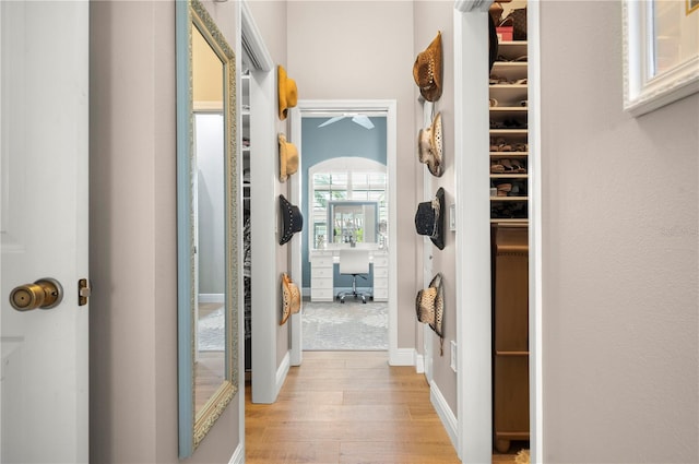 corridor featuring light hardwood / wood-style floors