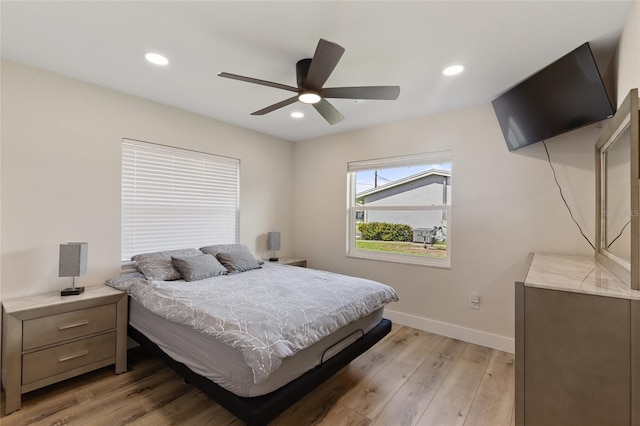 bedroom featuring ceiling fan and light wood-type flooring