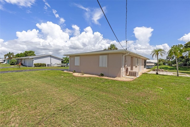 view of property exterior featuring a yard and cooling unit